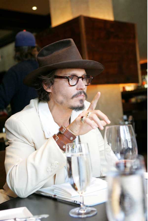 Jonny Depp - Wearing a white suit 2013