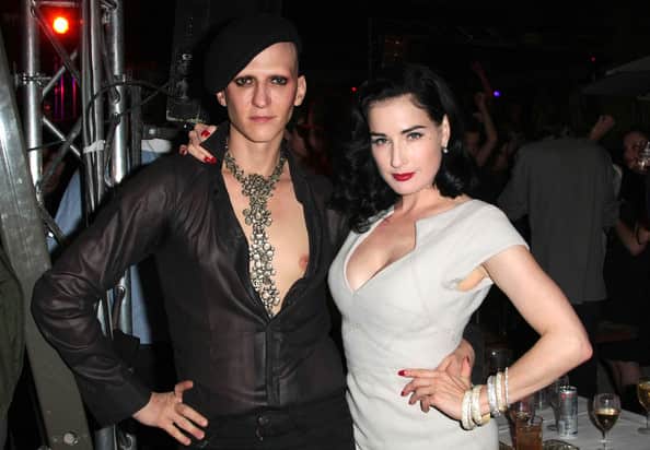 Dita Von Teese with Mr Pearl a man wearing corsets