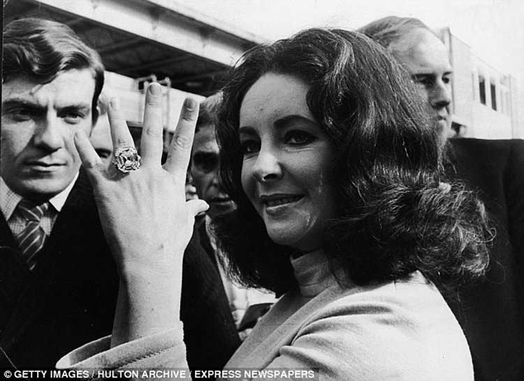 Elizabeth Taylor showing her diamond ring