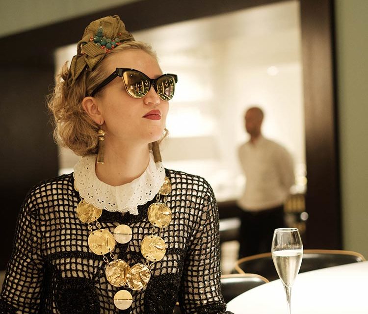 Black Noir Crochet Knitwear & Vintage Gold Accents: Style Tips for Hotel Stays