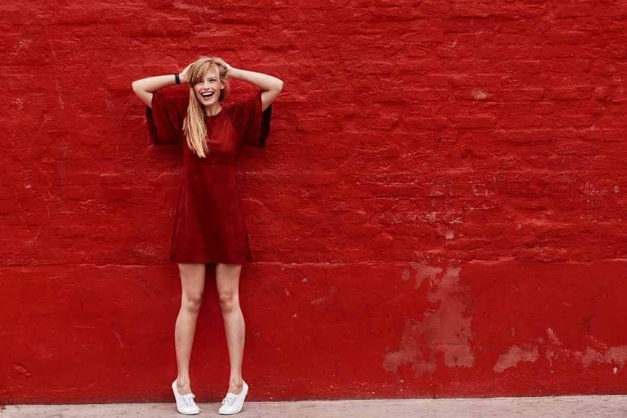 red wall red dress