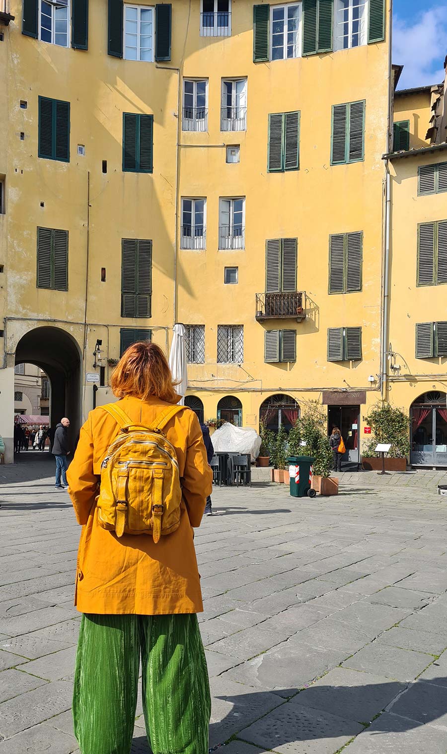 mustard spring leather coat and backpack