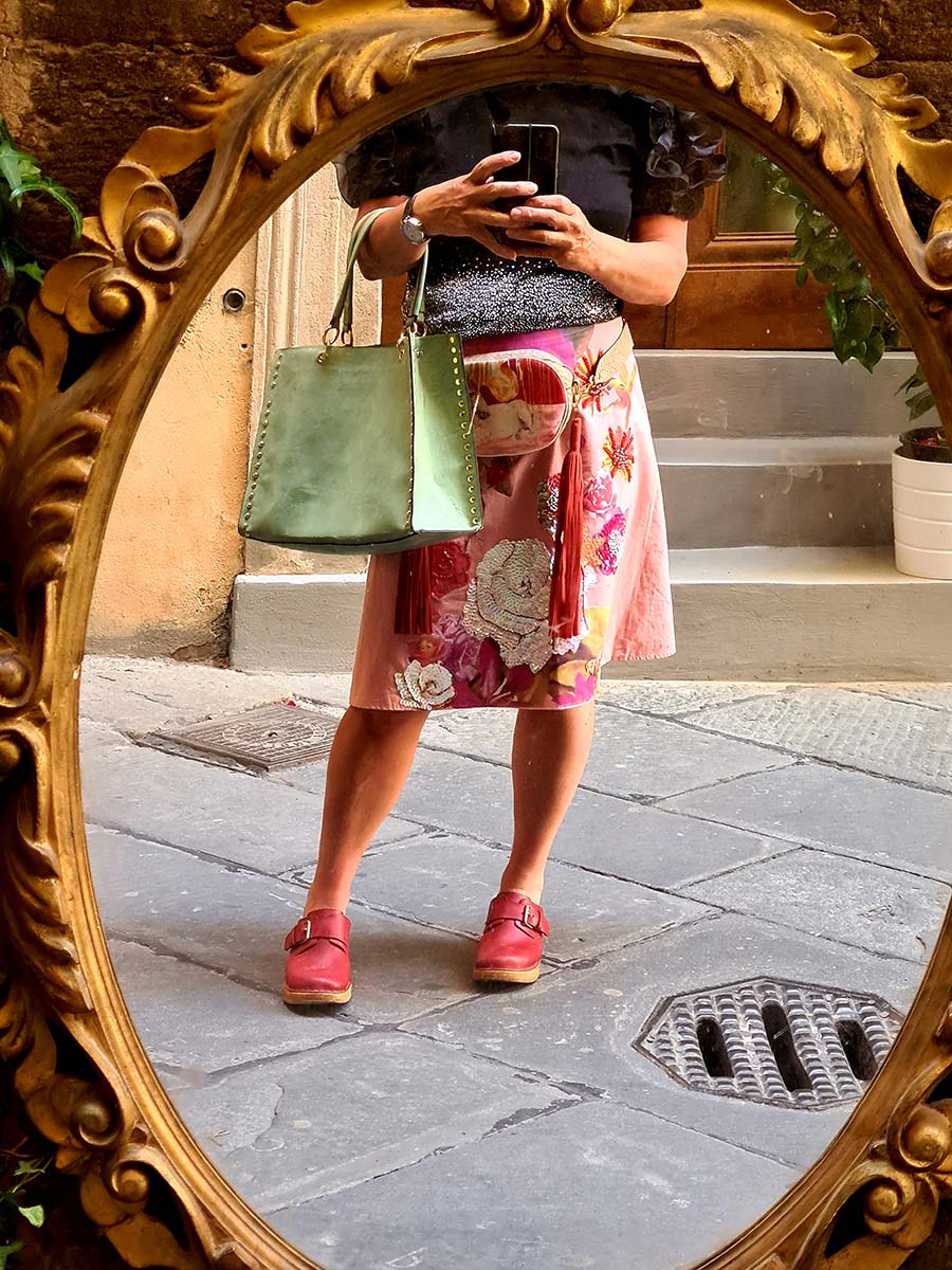 Gracie Opulanza bling skirt red clogs and green tote