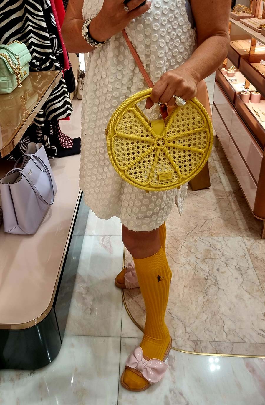 Gracie Opulanza wearing kate Spade Wicker Tote bag