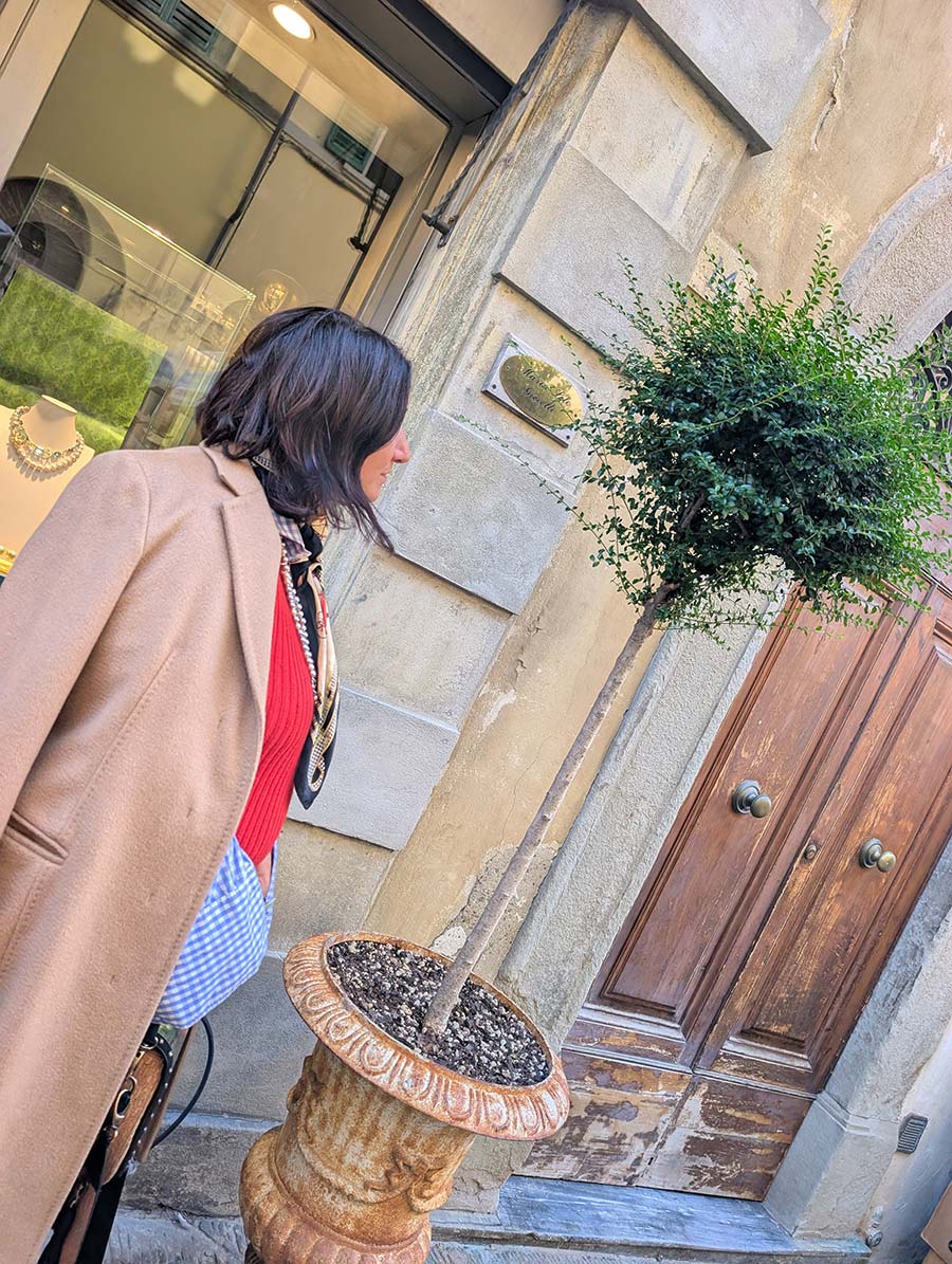 Gracie lives by vintage and pre-loved&mdash;fast fashion is not on the menu. This season she leans into Italian artisanship: a camel Max Mara jacket over a red knit dress, grounded by black boots, lifted with silk, and finished with a Siena-made vegan bag. Effortless, ethical, unmistakably her.